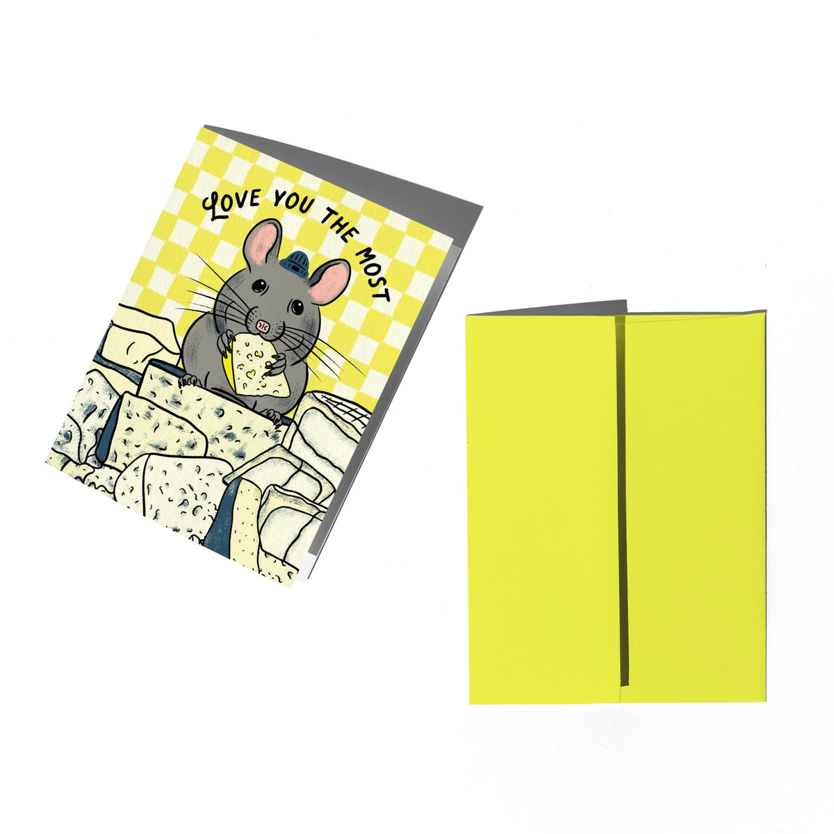 A folded greeting card and its matching backing sheet on a plain white background. The front of the card shows a cartoon gray mouse eating cheese over a yellow-and-white checkered pattern with the text 'LOVE YOU THE MOST'