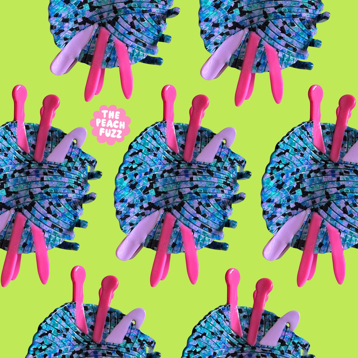 Pattern of blue and pink yarn balls with 'The Peach Fuzz' text on a green background