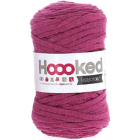 Ball of pink yarn with 'Hoooked' label on a white background