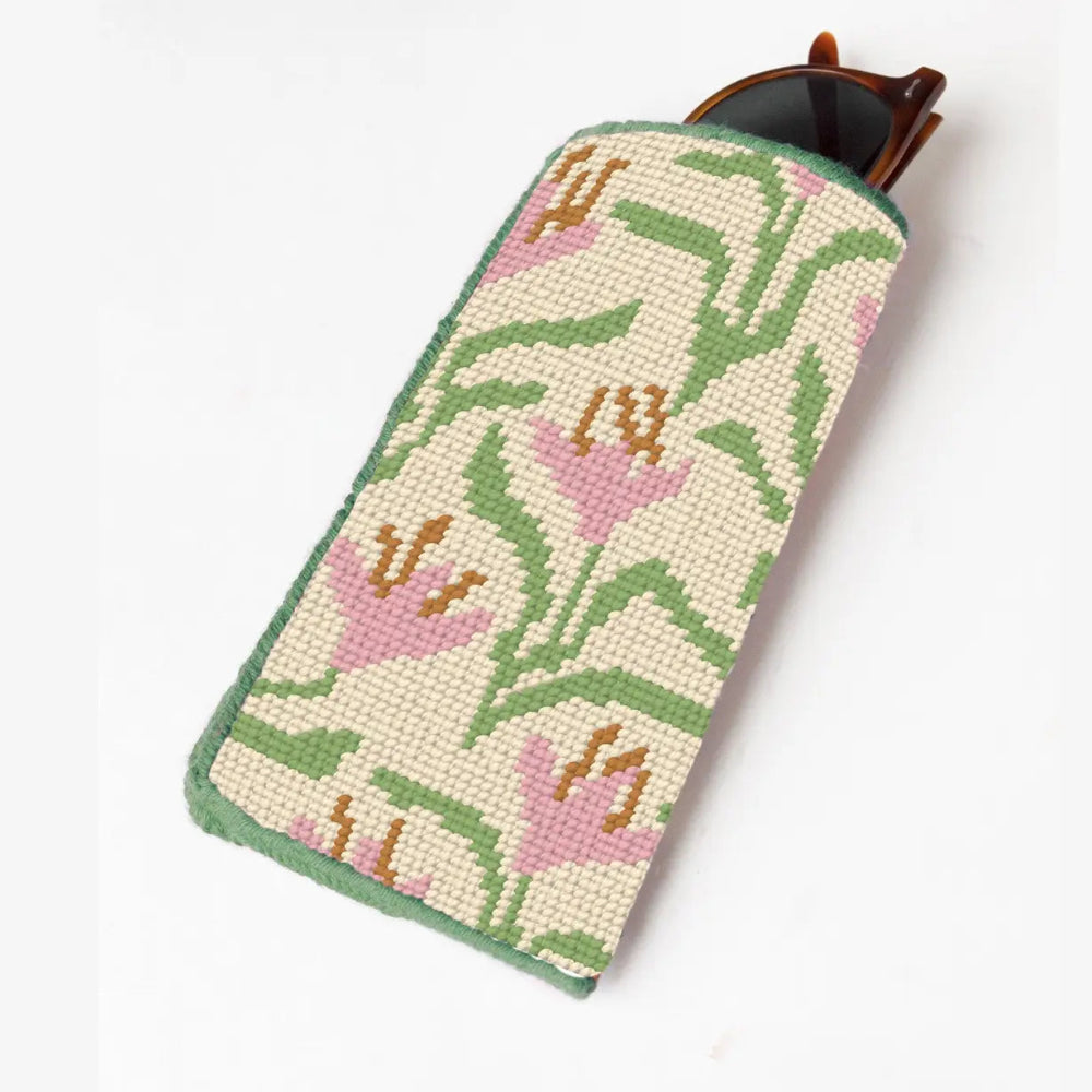 Needlepoint sunglasses case with floral pattern on a white background
