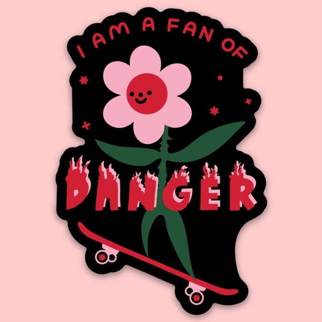 Pink flower on a skateboard with the words "I am a fan of danger" and "danger" is on fire.