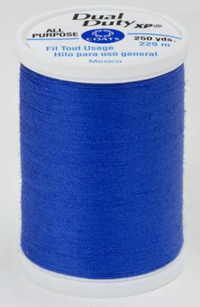 A spool of bright blue Dual Duty XP sewing thread with a white label featuring blue and black text, set against a plain white background.