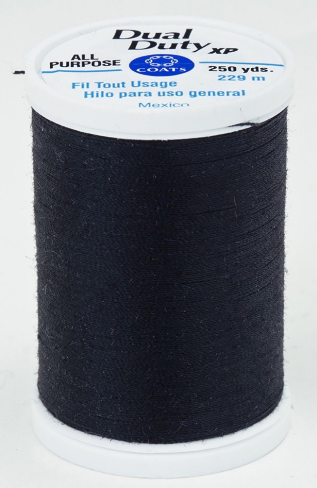 A spool of black Dual Duty XP sewing thread with a white label featuring blue and black text, set against a plain white background.