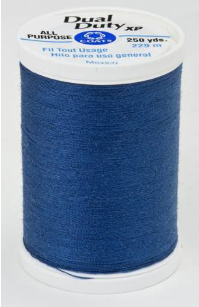 A spool of blue Dual Duty XP sewing thread with a white paper label, shown on a plain white background.