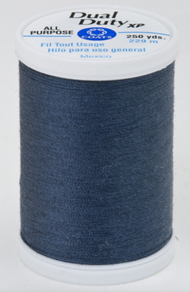 A spool of Dual Duty XP All Purpose sewing thread in a dark navy blue color, with a white plastic top and bottom cap.
