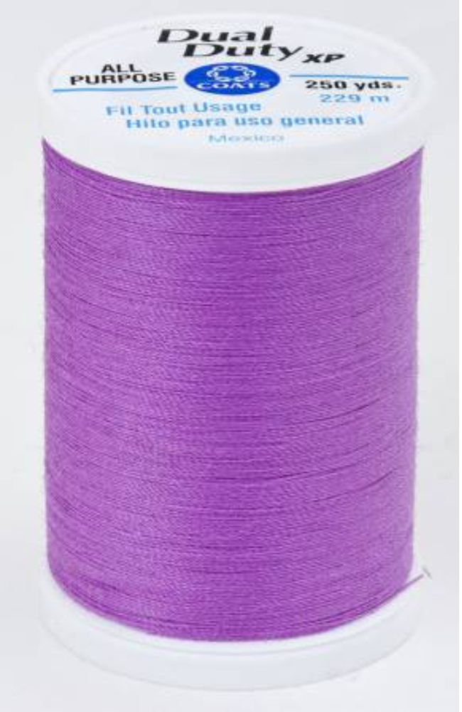 A spool of bright purple Dual Duty XP sewing thread with a white label featuring blue and black text, set against a plain white background.