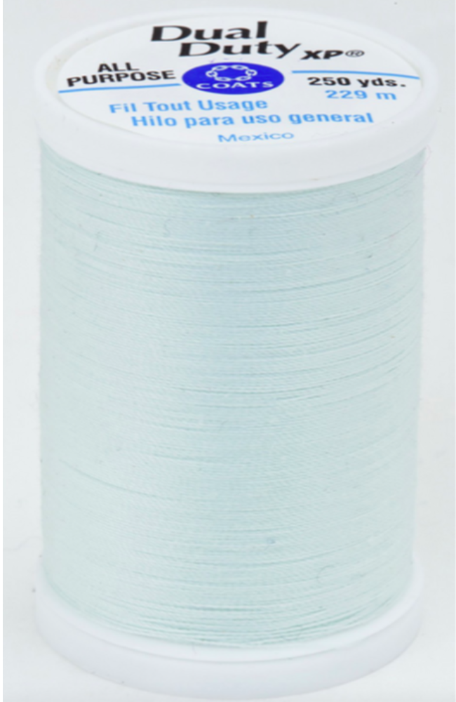 A spool of light blue Dual Duty XP sewing thread with a white label featuring blue and black text, set against a plain white background.
