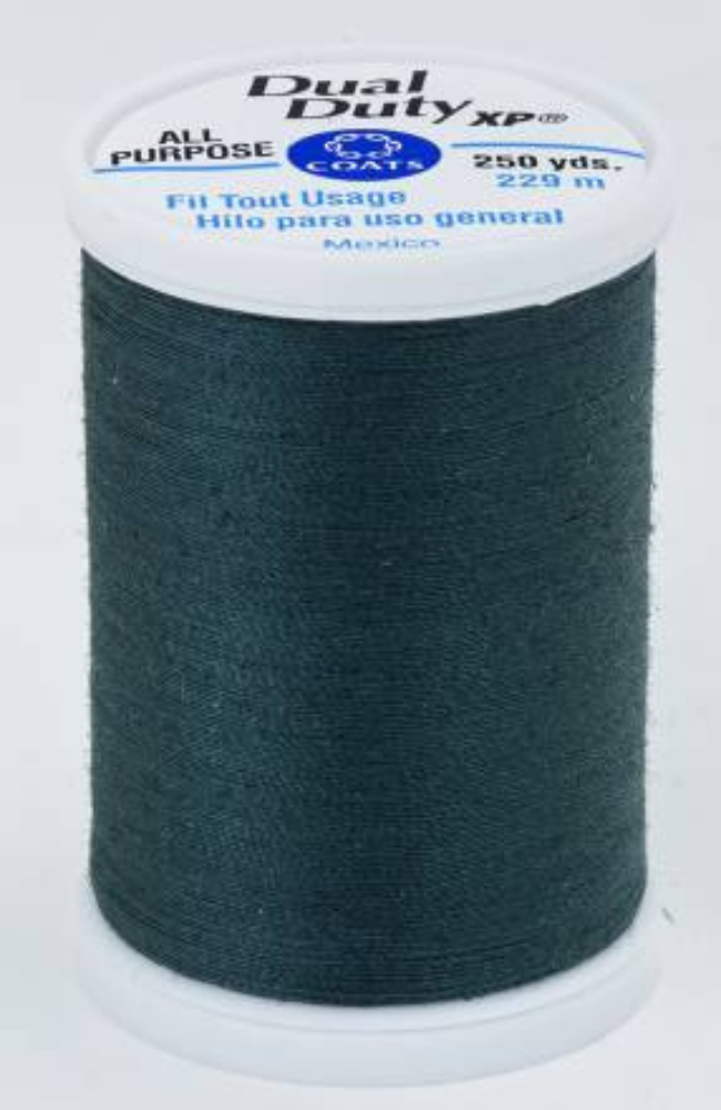A spool of dark green Dual Duty XP sewing thread with a white label featuring blue and black text, set against a plain white background.