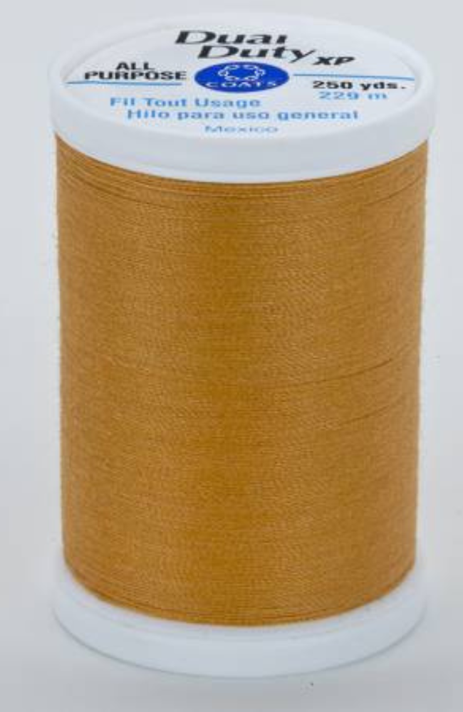 A spool of dark yellow Dual Duty XP sewing thread with a white label featuring blue and black text, set against a plain white background.