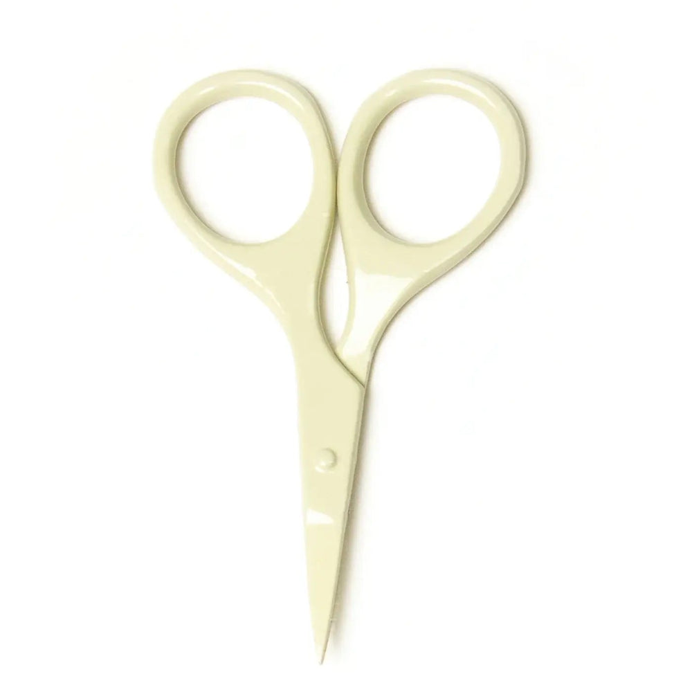 Pair of beige scissors on a white background