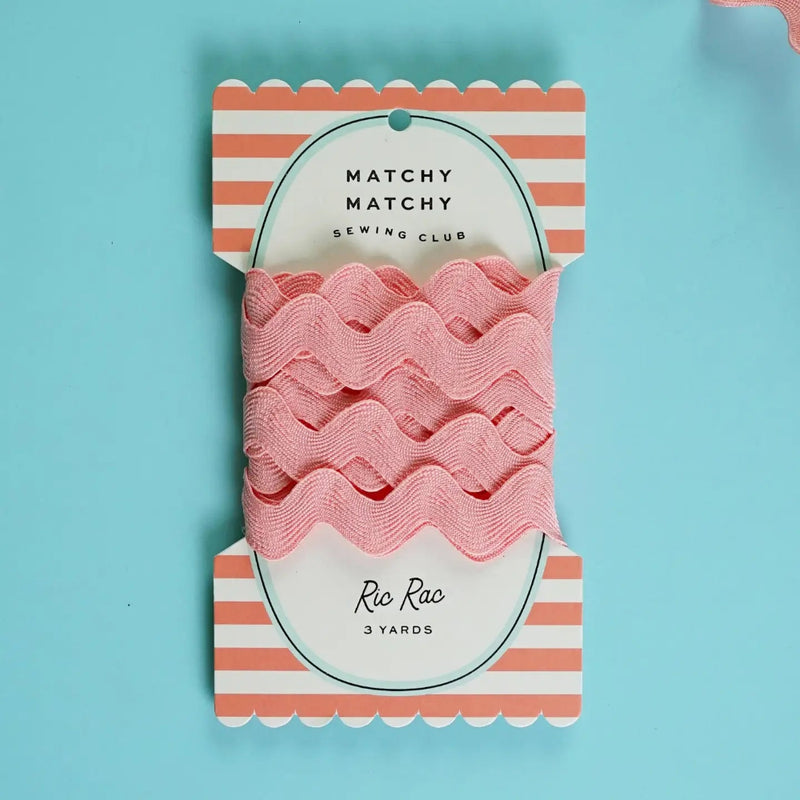 Packaged pink ric rac on a striped card with 'Matchy Matchy Sewing Club' branding on a blue background.