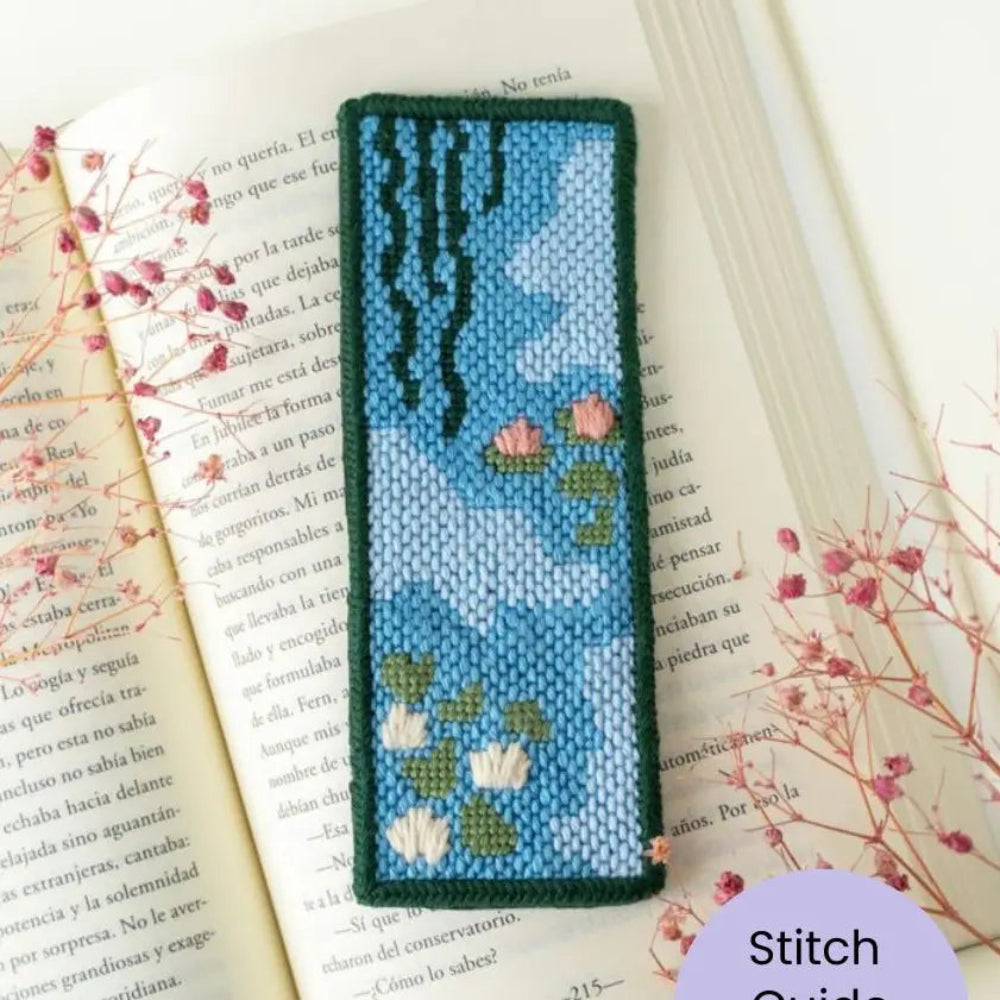 Needlepoint bookmark with floral design on an open book