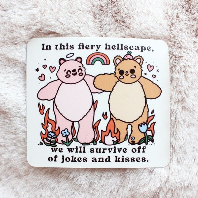 Two bears holding hands and standing in fire with a rainbow above and the words "In this fiery hellscape, we will survive off of jokes and kisses".