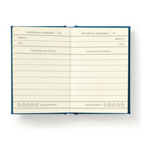 Open notebook with lined pages titled 'Potential Blackmail' on a white background