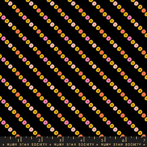 black fabric with pink, yellow and orange flower garland