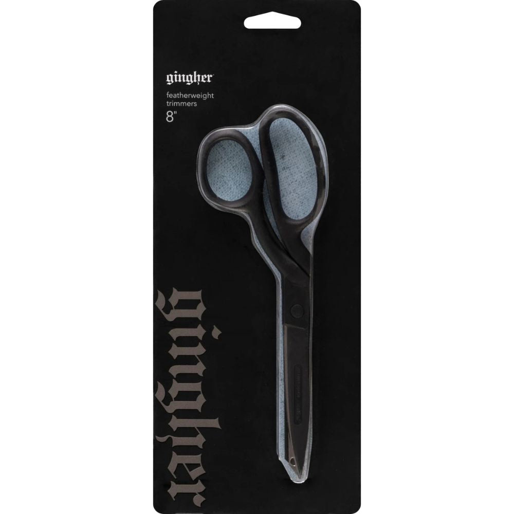 Ginther featherweight trimmers on a black packaging background
