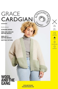 Woman with blonde curly hair in gray turtleneck shirt and light blue jeans wearing a cream and sage green knit sweater on a yellow and white background with Wool and the Gang branding and text.