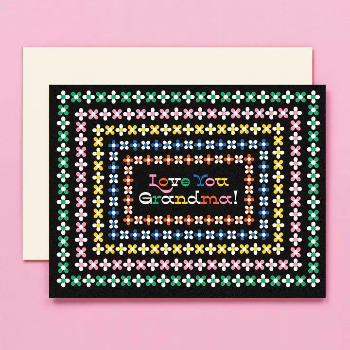 Greeting card with 'Love You Grandma!' text on a pink background