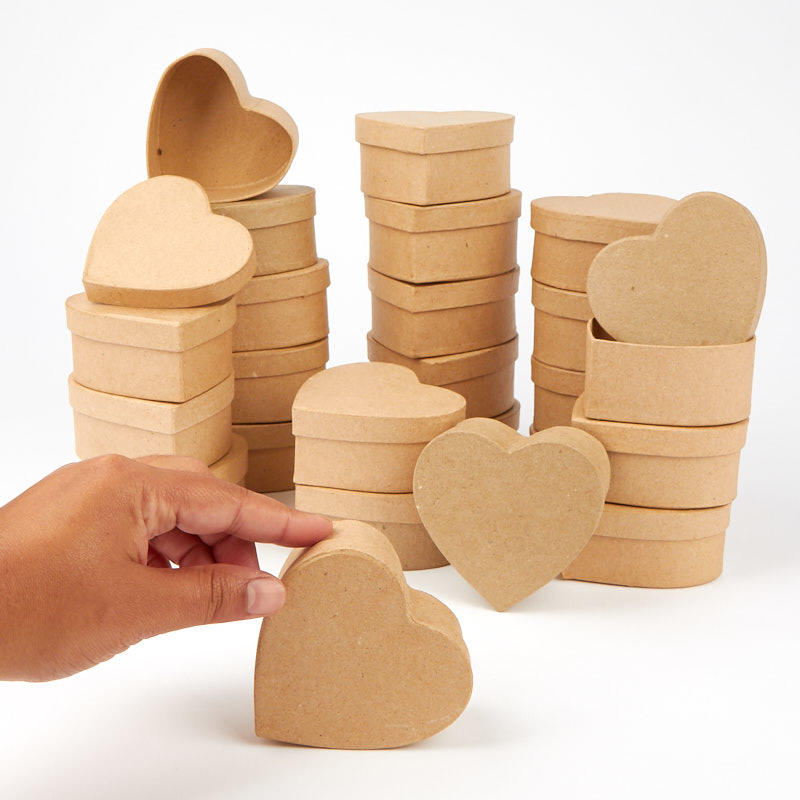 Heart-shaped cardboard boxes on a white background