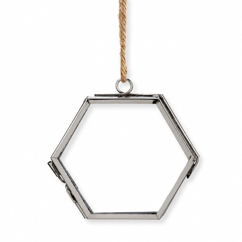 A hexagonal silver metal frame hanging ornament with a natural rope hanger, shown against a plain white background.