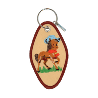 Tan embroidered motel-style keychain featuring a horse wearing a cowboy hat