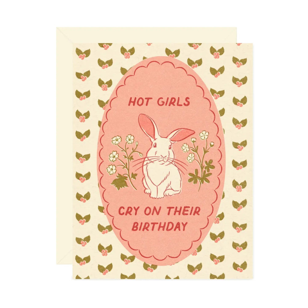 Greeting card with rabbit illustration and text  saying " Hot Girls Cry On Their Birthday" on a patterned background