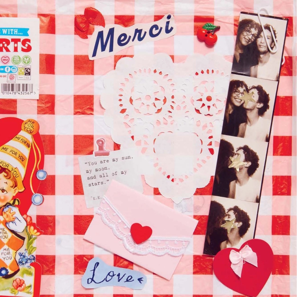 A junk journal spread with various colorful stickers and pictures on a red checked background
