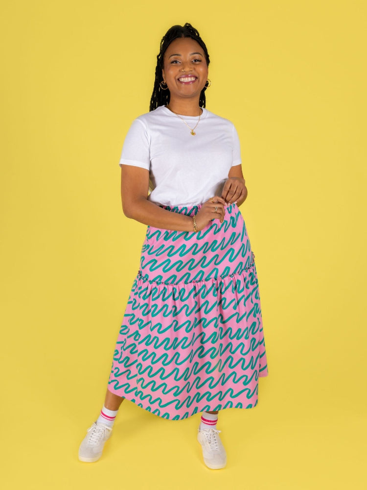 Jess (pink midi skirt) is wearing a size 6 (UK 16)