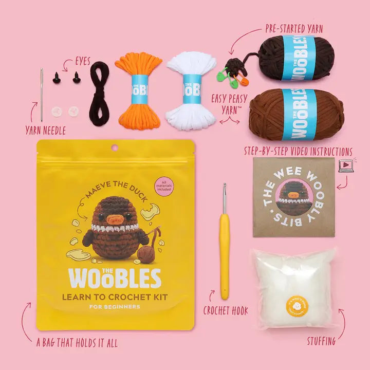 Content of the kit and the packaging including: yarn needle, eyes, easy-peasy yarn, pre-started yarn, instructions, a crochet hook and stuffing on a pink background