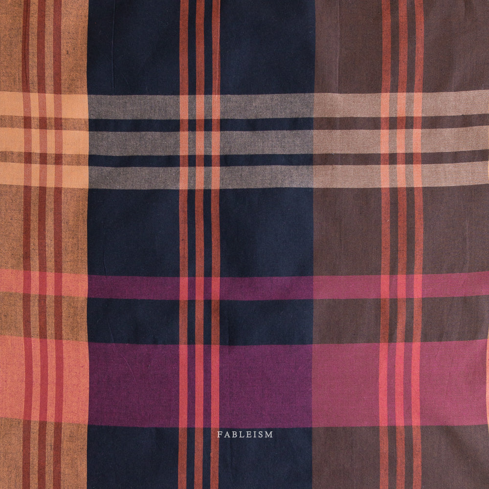 Plaid fabric with a mix of brown, purple, and red colors, 