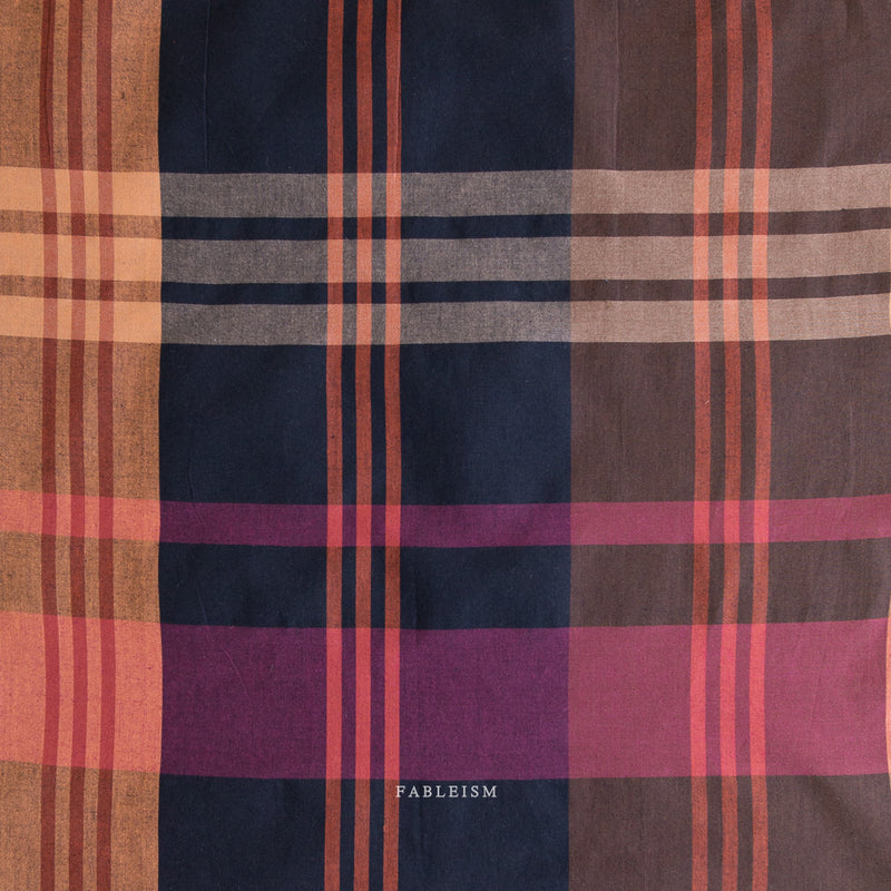 Plaid fabric with a mix of brown, purple, and red colors, 