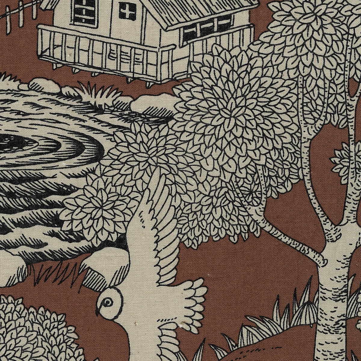 Patterned fabric with a house, trees, and animals on a brown background