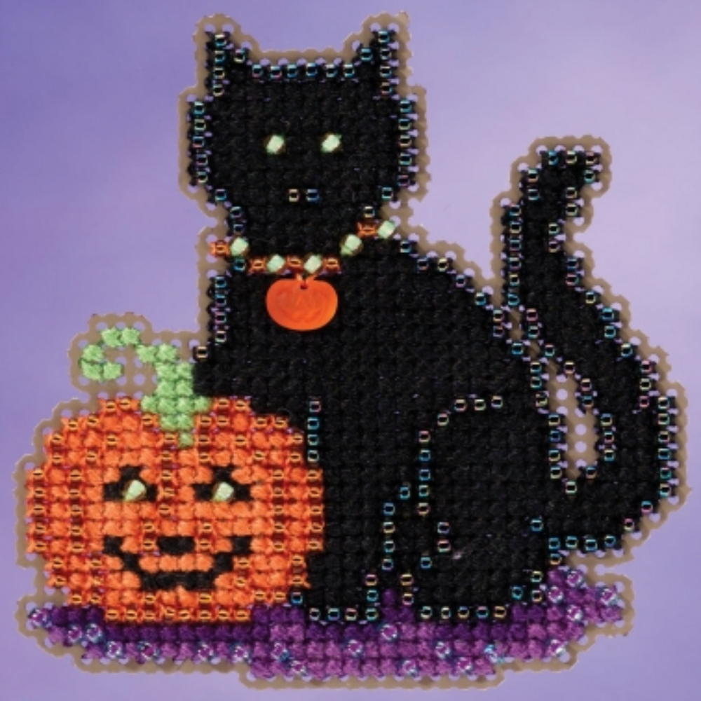 A beaded cross stitch design of a black cat sitting next to a carved orange pumpkin, set against a solid lavender-purple background.