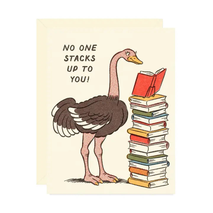 Beige greeting card featuring an ostrich beside a towering stack of books with the message “no one stacks up to you!” on a white background.