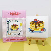Make Arcade mini cross stitch kit with a completed cross-stitched pancake design on a white background.