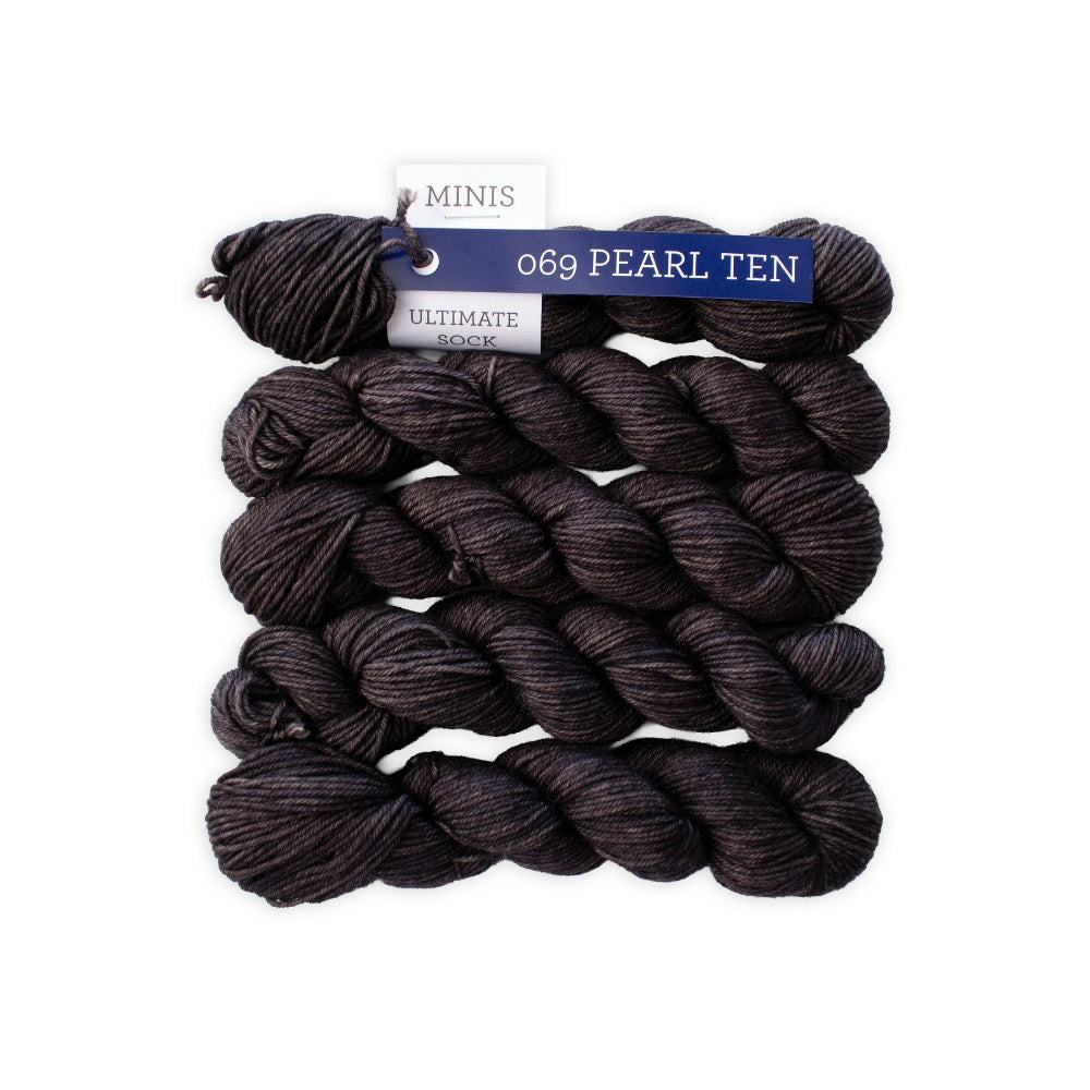 Dark yarn skeins with a label on a white background