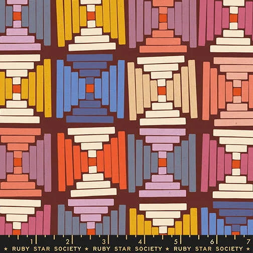 Colorful geometric pattern fabric with 'Ruby Star Society' label