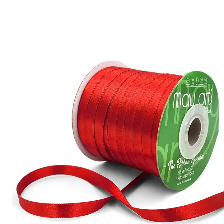 Red ribbon spool with visible brand name on a white background