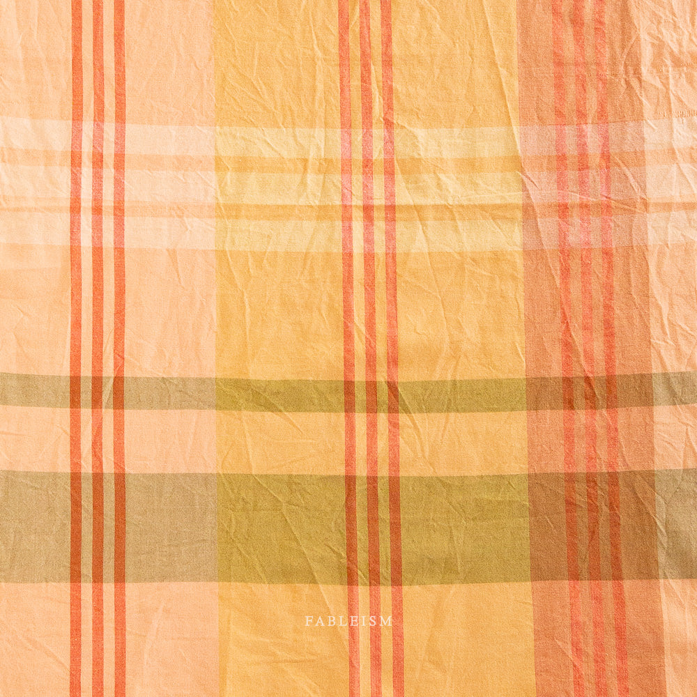 Plaid fabric with orange, yellow, and green colors