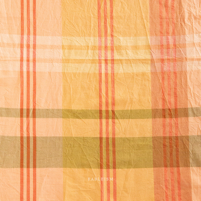 Plaid fabric with orange, yellow, and green colors