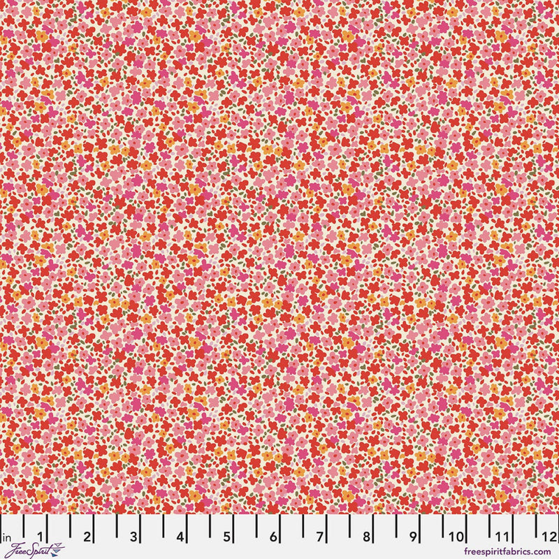 A close-up of a fabric pattern featuring a dense, small-scale floral print in shades of pink, red, orange, and yellow on a light pink background, with a white ruler scale at the bottom indicating inches.