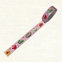 Decorative tape with cake designs on a pink checkered background