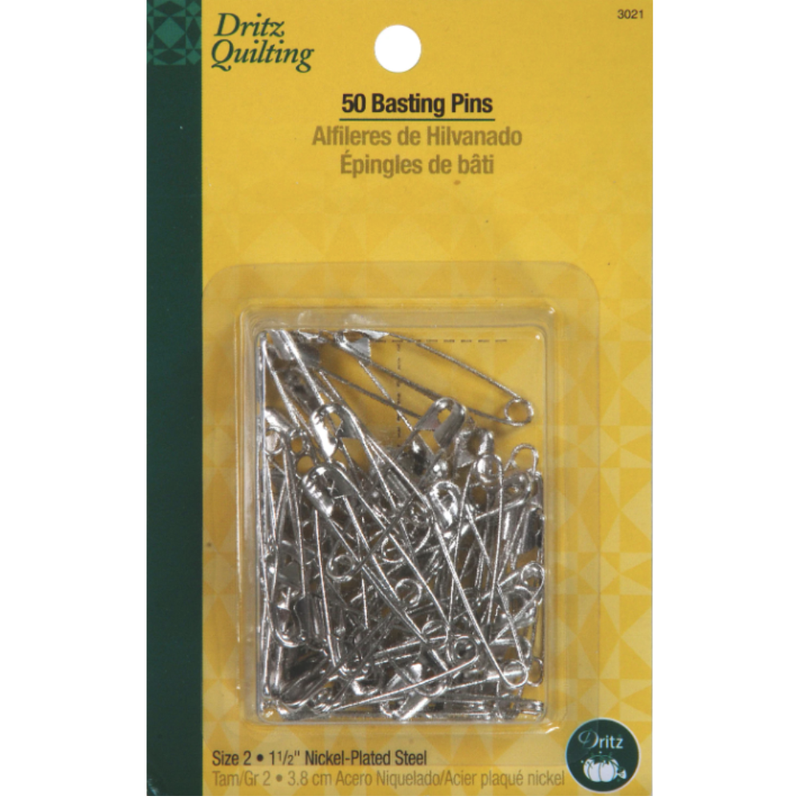 Package of Dritz Quilting basting pins with a yellow and green background