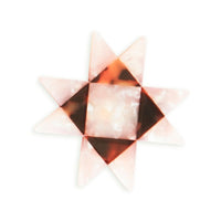 Geometric star-shaped object with a light pink and brown color pattern on a white background