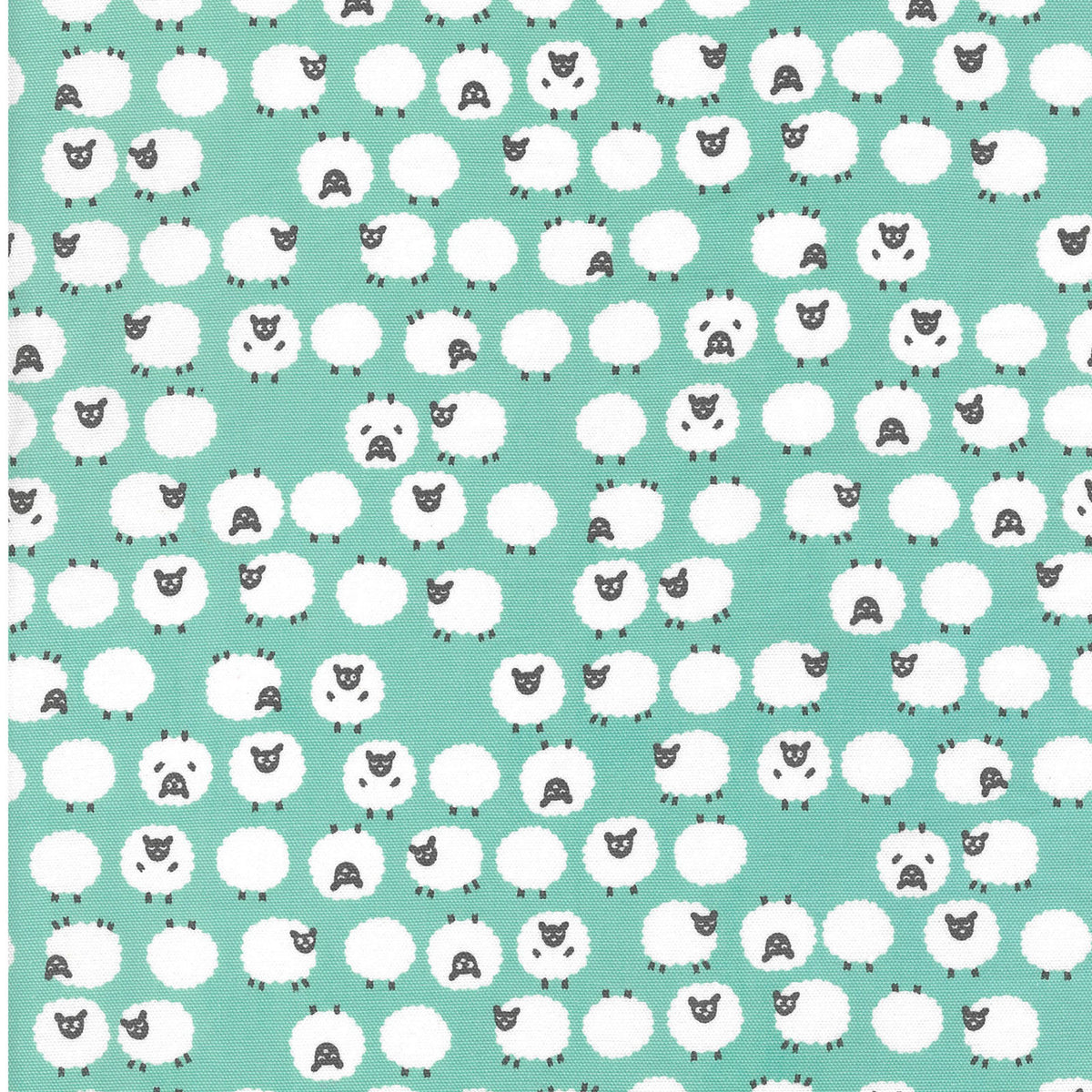 Patterned fabric featuring white sheep with black faces on an aqua background