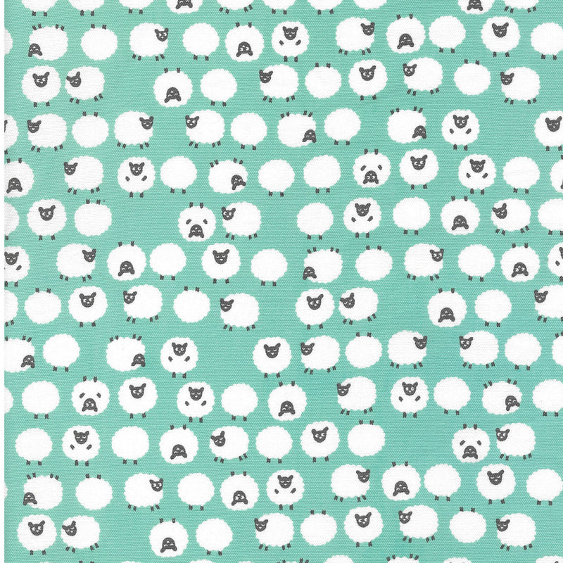 Patterned fabric featuring white sheep with black faces on an aqua background