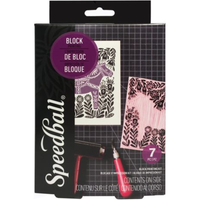 Speedball block printing kit in retail packaging, featuring a black box with purple and white graphics, showing sample printed blocks and a carving tool.