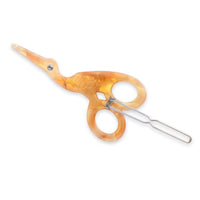 Pair of orange-handled scissors on a white background