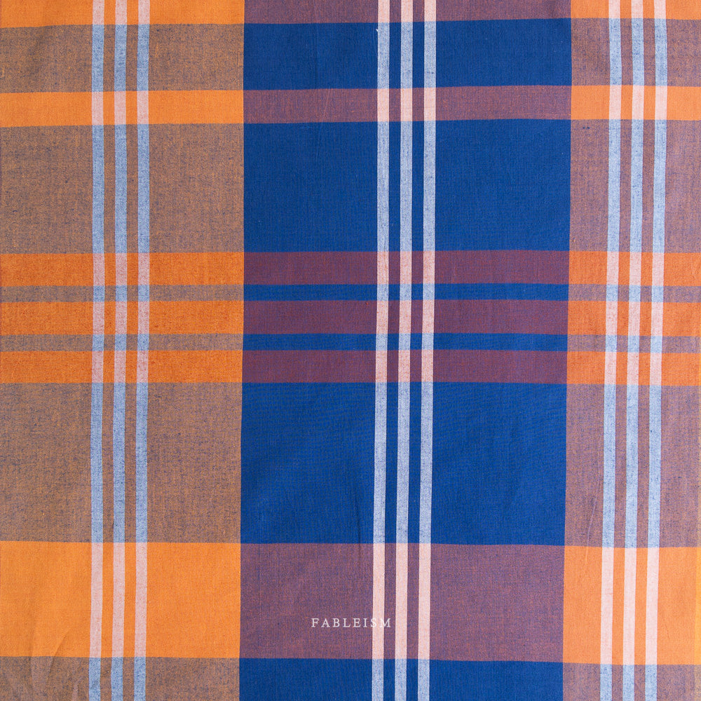 Plaid fabric with orange, blue, and brown colors