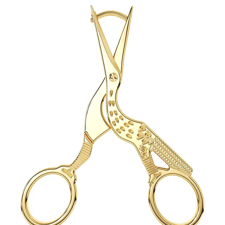 Gold stork scissors earring